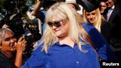 Debbie Rowe, ex-wife of singer Michael Jackson, leaves after testifying in a lawsuit brought by the late singer's family against concert promoter AEG Live, at Los Angeles Superior Court in Los Angeles, California, August 14, 2013.