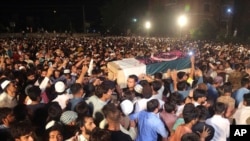 Pakistani attend funeral of Pakistani soldier Taimoor Aslam who reportedly was killed during a firing at the Line of Control between Pakistan and Indian Kashmiris, Aug. 16, 2019, in Lahore, Pakistan. 