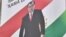 FILE - Campaign material for Moscow-backed incumbent Emomali Rakhmon, who has ruled the former Soviet republic since 1992.