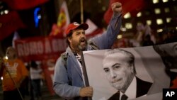 A demonstrator shouts slogans against Brazil's President Michel Temer during a protest in Rio de Janeiro, Brazil, Sept. 22, 2016.