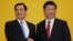 FILE - Chinese President Xi Jinping shakes hands with Taiwan's President Ma Ying-jeou during a Nov. 7, 2015, summit in Singapore. Leaders of political rivals China and Taiwan met Saturday for the first time in more than 60 years.