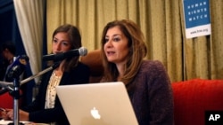 FILE - Human Rights Watch MENA director, Sarah Leah Whitson (r) speaks during a press conference in Sanaa, Yemen, Jan. 27, 2014. 