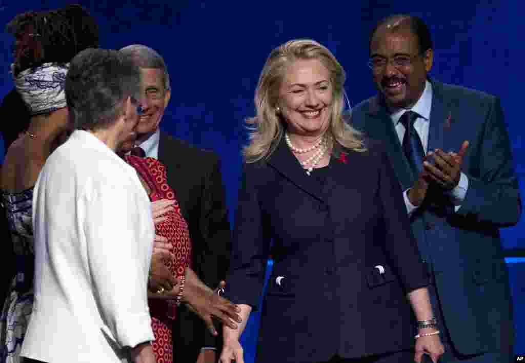 Secretary of State Hillary Clinton arrives to speak at the AIDS Conference, July 23, 2012.