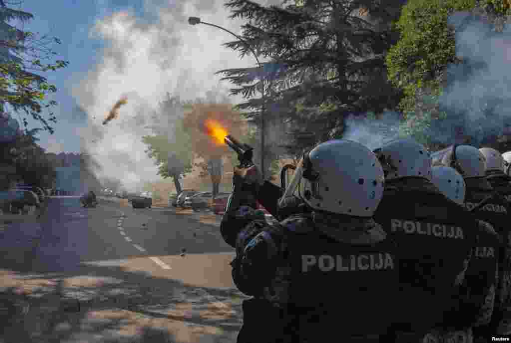 Police fire teargas at opponents of same-sex rights in Podgorica. Some 150 supporters of same-sex rights, guarded by almost 2,000 policemen, staged the first Pride March in the Montenegrin capital and hailed it as a herald of better times, Oct. 20, 2013.