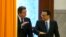 British Prime Minister David Cameron, left, chats with Chinese Premier Li Keqiang as they arrive for a welcome ceremony at the Great Hall of the People in Beijing, China, Monday, Dec. 2, 2013.