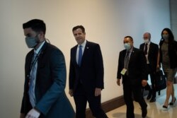 FILE - Director of National Intelligence John Ratcliffe leaves after briefing senators on Capitol Hill about reports of Russia paying bounties for the killing of U.S. troops in Afghanistan July 1, 2020, in Washington.