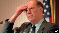FILE - Lyndon LaRouche gestures during a news conference in Arlington, Va., Feb. 3, 1994.