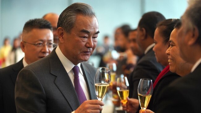 China's Foreign Minister Wang Yi toasts with Nauru diplomats after signing the joint communiqué on the resumption of diplomatic relations between the People's Republic of China and the Republic of Nauru at the Diaoyutai State Guesthouse in Beijing on Jan. 24, 2024.