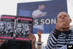 Demonstrators protest against Prime Minster Benjamin Netanyahu outside the court in Tel Aviv, Israel, on Dec. 10, 2024.