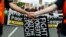 FILE - Demonstrators march outside the U.S. Capitol during the Poor People's Campaign rally at the National Mall in Washington, June 23, 2018. 