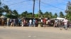 FILE - Residents visit a market in Macomia, northern Mozambique, June 11, 2018. Some experts believe IS has already set its sights on Mozambique, particularly its northern region, because of the economic disparity that, in part, allows radical Islamist ideology to flourish.