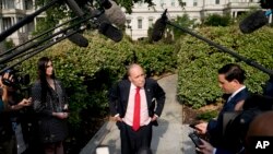 White House chief economic adviser Larry Kudlow speaks to the media after finishing interviews on the North Lawn of the White House, Aug. 16, 2018.
