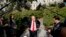 White House chief economic adviser Larry Kudlow speaks to the media after finishing interviews on the North Lawn of the White House, Aug. 16, 2018.