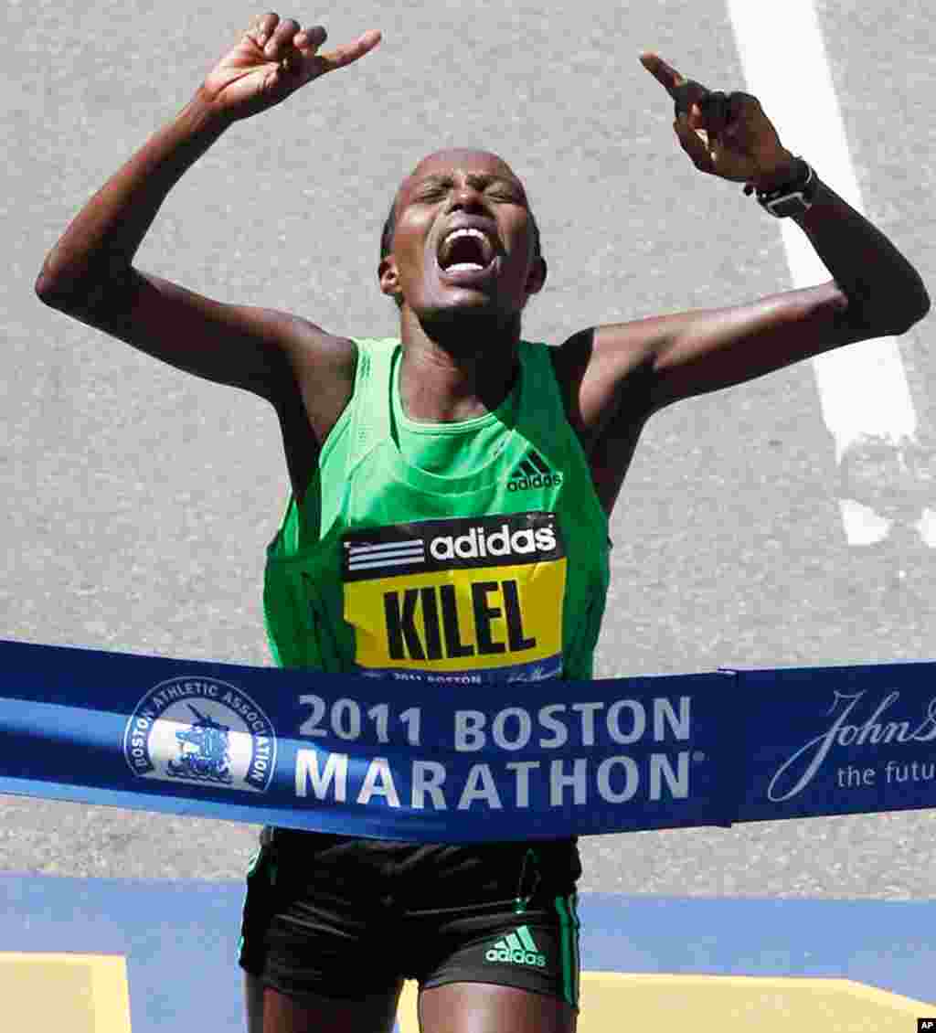 April 18: Caroline Kilel of Kenya reacts as she hits the tape at the finish line to win the women's division of the 115th Boston Marathon in Boston. (AP Photo/Charles Krupa)