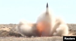 FILE - A still image, taken from a video footage and released by Russia's Defense Ministry on Aug. 31, 2019, shows a nuclear-capable short-range Iskander missile at the Kapustin Yar military shooting range near Astrakhan, Russia.