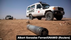 FILE - An unexploded ordnance is seen in North Darfur, March 27, 2011. 