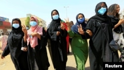 FILE - Women chant slogans during a pro-democracy protest in Khartoum, Sudan, June 30, 2020.