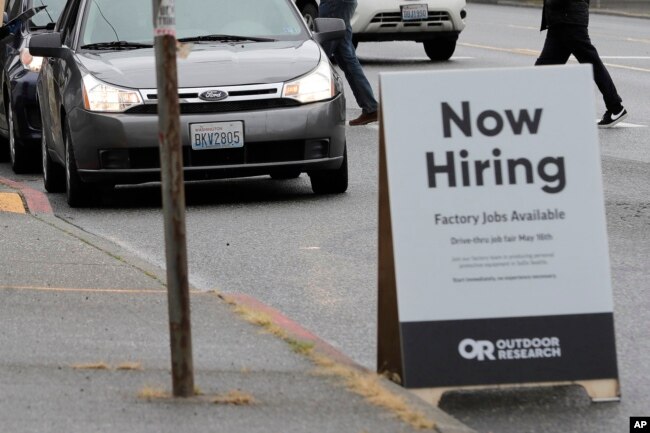 FILE - A drive-up job fair in Seattle, Washington on May 16, 2020. Some businesses say they do not want to hire members of Gen Z. (AP Photo/Ted S. Warren)