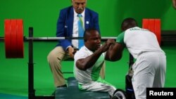 FILE - Roland Ezuruike of Nigeria reacts during the men's Paralympic Powerlifting competition, Rio de Janeiro, Brazil, Sept. 9, 2016. 