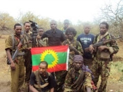 Kenyan journalist Yassin Juma pictured with a group of armed men while working on a documentary about an insurgency in Ethiopia's Oromia region. (Photo courtesy Yassin Juma)