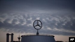FILE - The Mercedes star is pictured at the Mercedes Benz headquarters in Stuttgart, Germany, July 8, 2020.