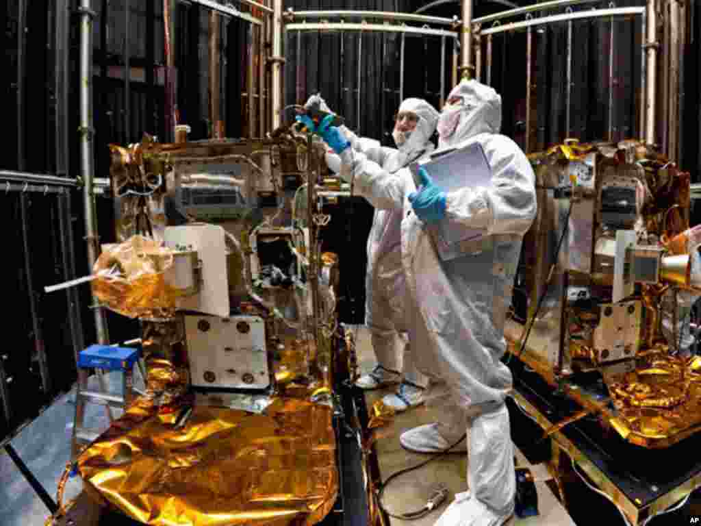 Technicians prepare to hoist one of the two GRAIL spacecraft upon completion of a thermal vacuum test at the Lockheed Martin Space Systems facility in Denver. (NASA)