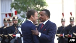 FILE: In a reverse of today's ceremony in Brazzaville, French President Emmanuel Macron (L) welcomes Republic of the Congo's President Denis Sassou Nguesso at the Elysee Palace in Paris. Taken Sept. 3, 2019