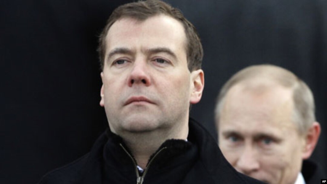 Dmitry Medvedev, left, and Vladimir Putin (File)