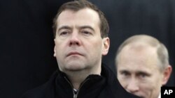 Dmitry Medvedev, left, and Vladimir Putin (File)