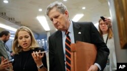 Sen. John Kennedy, R-La., arrives at the Capitol in Washington, Oct. 4, 2018.