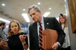 Sen. John Kennedy, R-La., arrives at the Capitol in Washington, Oct. 4, 2018.