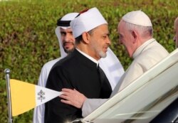 FILE - Pope Francis is welcomed by Grand Imam of al-Azhar Sheikh Ahmed el-Tayeb at the sheikh Zayed grand Mosque in Abu Dhabi, United Arab Emirates, Feb. 4, 2019.