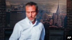 Michael Koveleski in the showroom of their store Design Sleep where an aerial photograph of the Chrysler Building hangs on their wall in Yellow Springs, Ohio, Aug. 23, 2018.