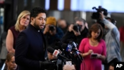 FILE - Actor Jussie Smollett talks to the media before leaving Cook County Court after his charges were dropped March 26, 2019, in Chicago.