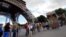 People queue to visit the Eiffel tower, Aug. 9, 2013 in Paris, after the monument reopened its door following its evacuation over a bomb alert.