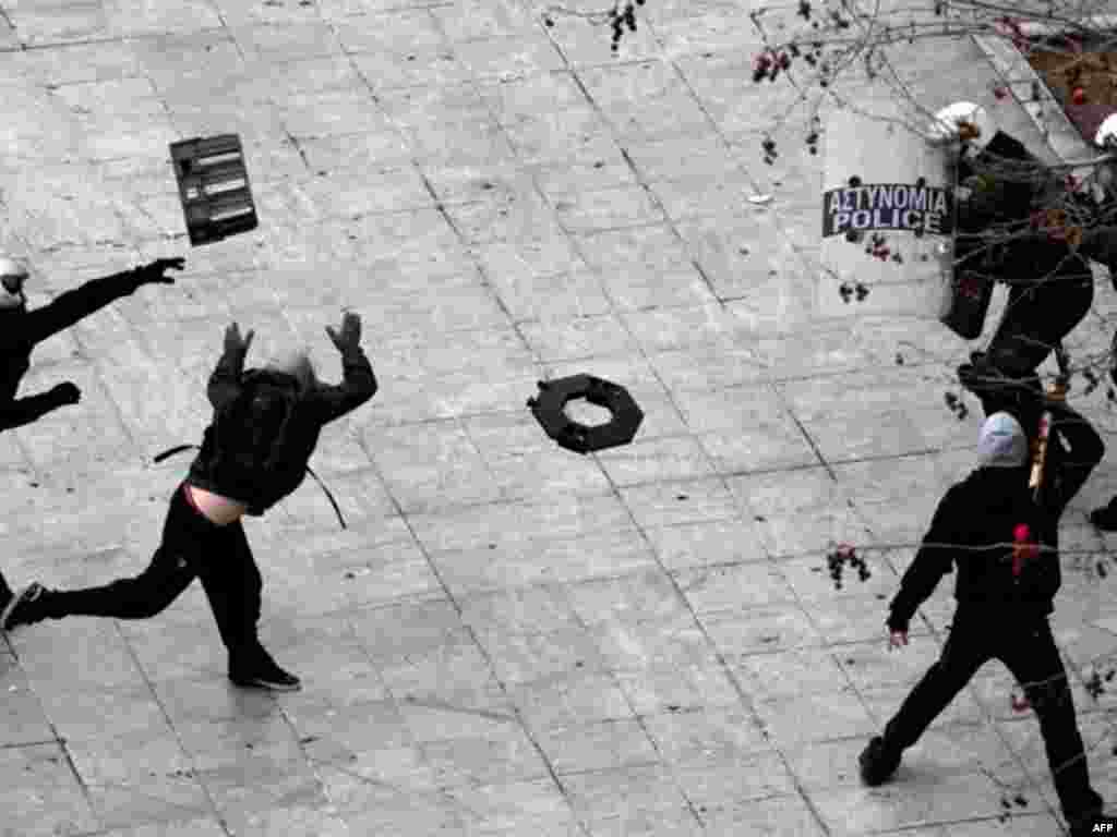 Riot police clash with demonstrators during a protest in Athens on February 10, 2012. (AP)