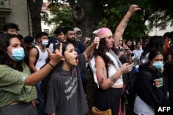 FILE—Pro-Palestinian students gesture as they protest the Israel-Hamas war on the campus of the University of Texas in Austin, Texas, on April 24, 2024.