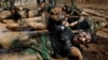 Members of Kurdish Peshmerga Special Forces demonstrate their skills during their graduation ceremony at a military camp in Soran district, in Erbil province, Iraq.