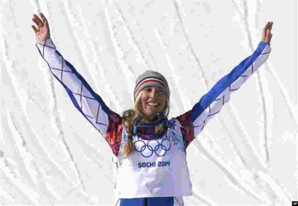 France's Chloe Trespeuch celebrates after taking the bronze medal in the women's snowboard cross final at the Rosa Khutor Extreme Park, at the 2014 Winter Olympics, Sunday, Feb. 16, 2014, in Krasnaya Polyana, Russia. (AP Photo/Andy Wong)