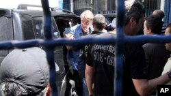 Businessman Eike Batista disembarks from a vehicle as he arrives to the Ary Franco prison, in Rio de Janeiro, Brazil, Jan 30, 2017.