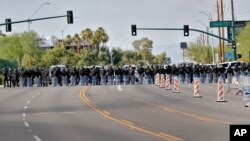 Phoenix Police clear the street after they used crowd dispersement tactics outside Dream City Church Tuesday, June 23, 2020, in Phoenix as President Donald Trump was speaking to young Republicans inside the church. 