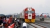 FILE - Kenyans watch the SGR cargo train as it leaves Mombasa for Nairobi, May 30, 2017. The project was a $3.3 billion investment backed by China. Research released in September 2023, however, shows Chinese lending to Africa has fallen sharply. 