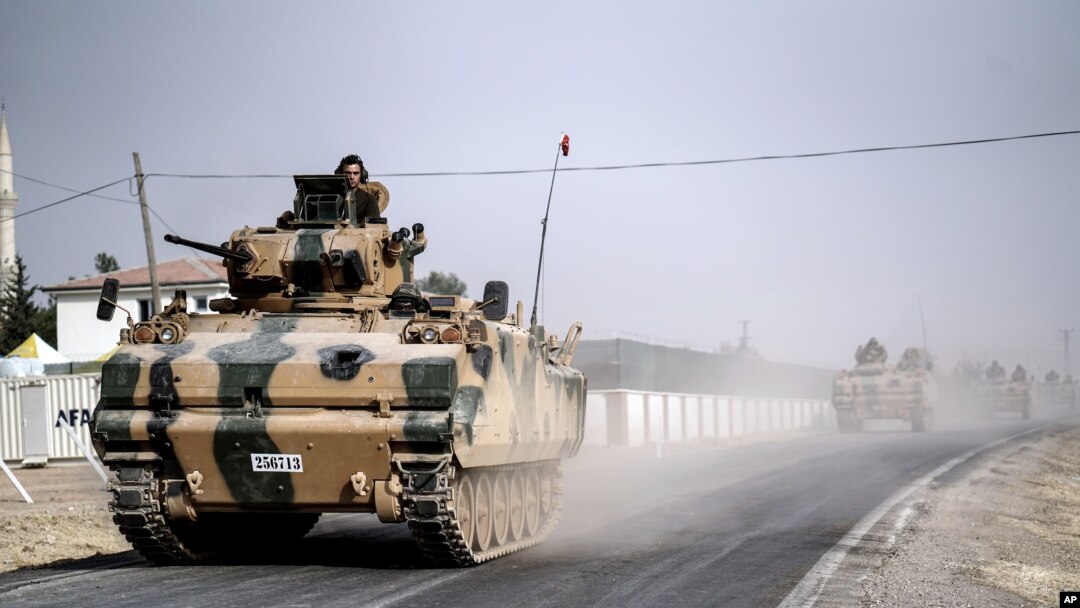 Turkish army tanks and armored personnel carriers move toward the Syrian border, in Karkamis, Turkey, Aug. 25, 2016. Ankara on Saturday launched a second incursion into Syria in as many weeks.
