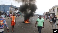 Aksi demonstrasi menentang Presiden Joseph Kabila berlangsung rusuh di Kinshasa, Kongo, Minggu (31/12). 