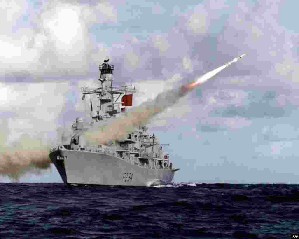 In this handout picture retrieved from the British Ministry of Defence (MOD) via Defence News Imagery the British Royal Navy Type 23 frigate, HMS Iron Duke, is pictured at sea firing her Harpoon anti-ship missile.