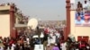 A crowd of All Progressives Congress (APC) party supporters gather to welcome APC presidential candidate Muhammadu Buhari at the Kano Stadium, in Kano, Nigeria, Jan. 20, 2015. 