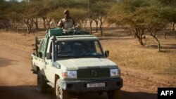 FILE - A vehicle of the Burkina Faso Army patrols a rural area in the Soum region in northern Burkina Faso, Nov. 14, 2019. 