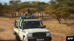 FILE - A vehicle of the Burkina Faso Army patrols a rural area in the Soum region in northern Burkina Faso, Nov. 14, 2019. 