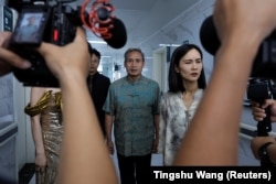 Actors on the set of a microfilm during a filming session at a hospital in Zhengzhou, Henan province, China, July 17, 2024. REUTERS/Tingshu Wang