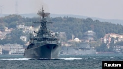 The Russian Navy's frigate Pytlivy, followed by landing ship Nikolai Filchenkov, sails in the Bosphorus, on its way to the Mediterranean Sea, in Istanbul, Turkey, Aug. 24, 2018. 